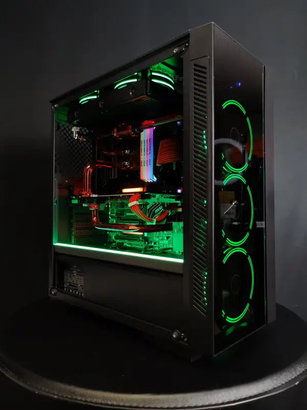 Custom liquid cooled Alpha PC with vibrant green and red LED lighting for gaming