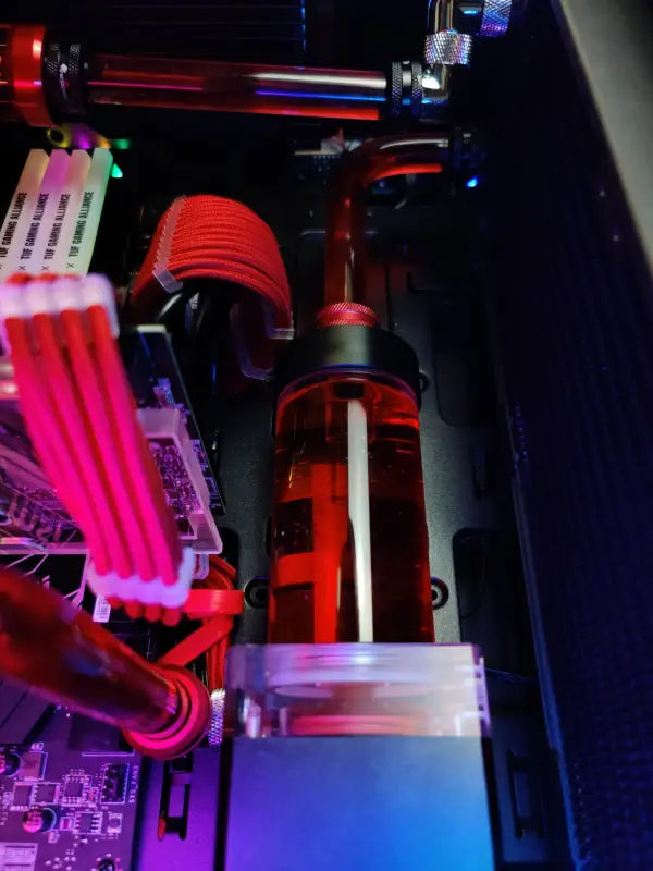 Red liquid-cooled PC reservoir in Alpha PC Liquid Cooled Gaming PC with Purple LED Lighting