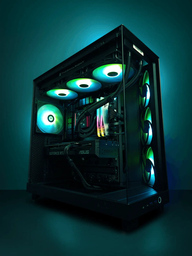Black asus gaming pc with multiple glowing green and blue led fans.