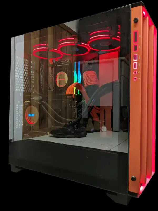 Custom-built orange and black liquid cooled gaming computer tower with red LED lights