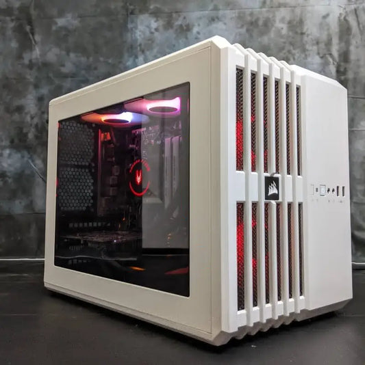 White mini gaming PC case with tempered glass panel showcasing modern design